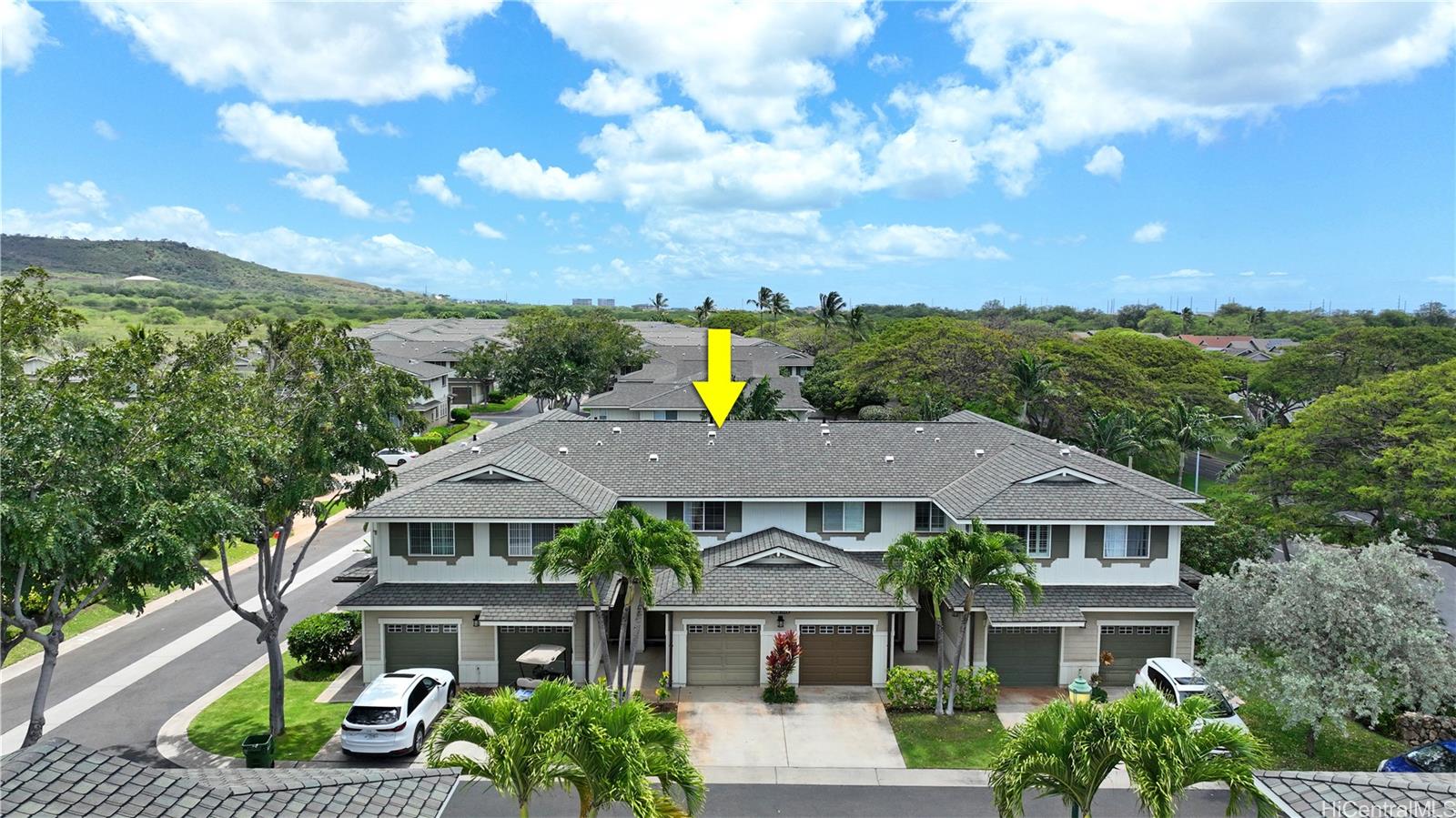 92-1490 Ali'inui Drive, Unit 803 Kapolei, HI 96707 - Photo 3 of 20 a view of a house with a garden