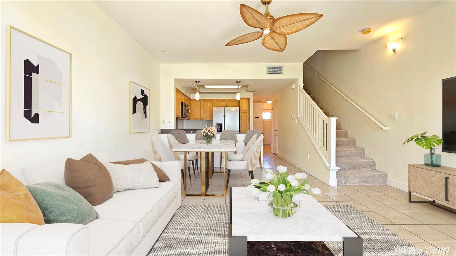 92-1490 Ali'inui Drive, Unit 803 Kapolei, HI 96707 - Photo 7 of 20 a living room with furniture and a chandelier