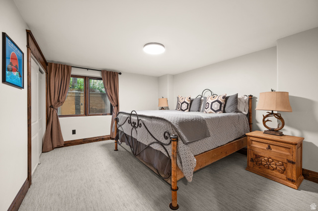 10280 Dimple Dell Road Sandy, UT 84092 - Photo 52 of 58 Bedroom with baseboards and light carpet
