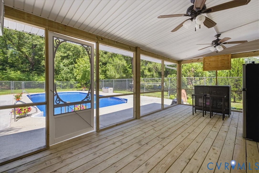 404 Bermuda Hundred Road Chester, VA 23836 - Photo 30 of 37 Screened porch featuring light wood-finish decking