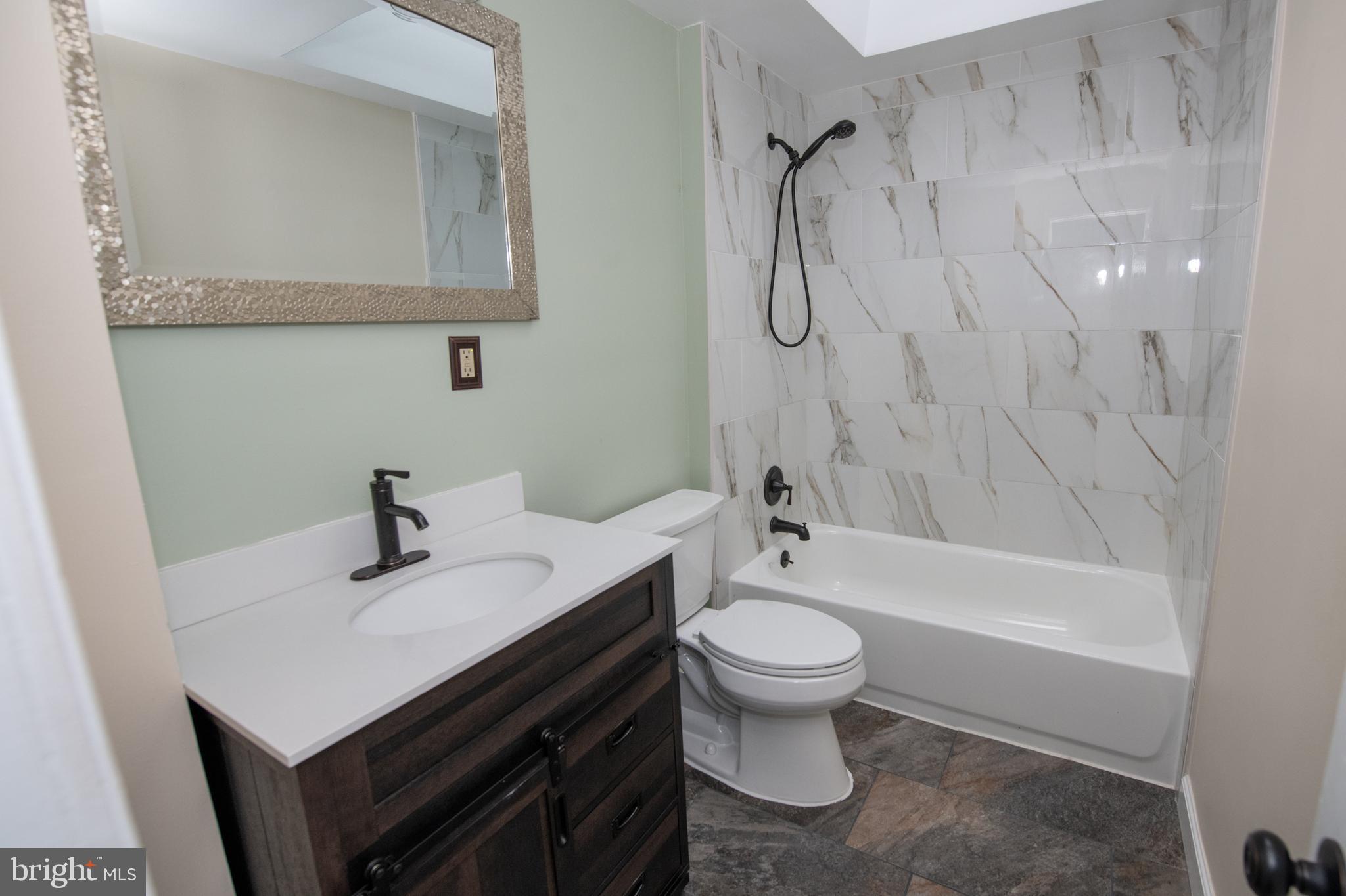 784 Bennington Road Folcroft, PA 19032 - Photo 24 of 36 a bathroom with a sink a toilet and a bathtub