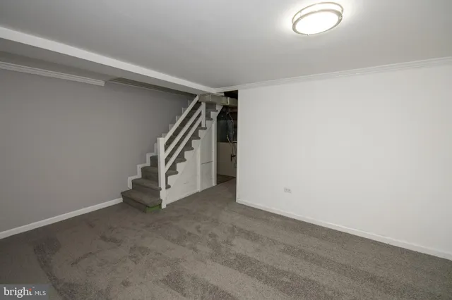 an empty room with staircase