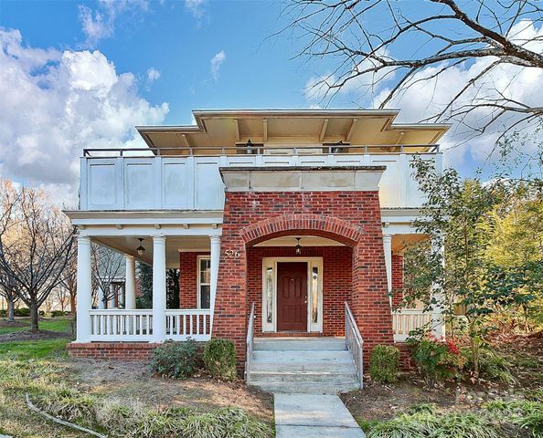 a front view of a house with a porch