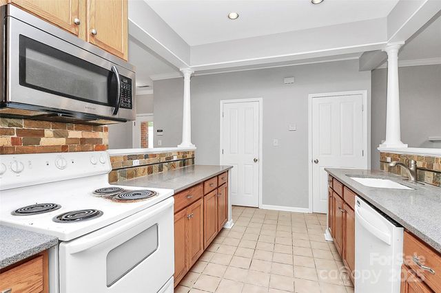 a kitchen with a stove and a microwave