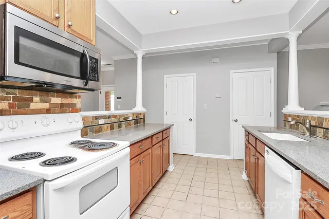 a kitchen with a stove and a microwave