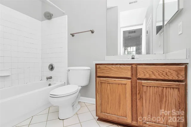 a bathroom with a toilet a sink and bathtub