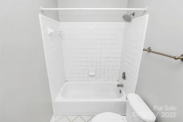 a bathroom with a bathtub and shower