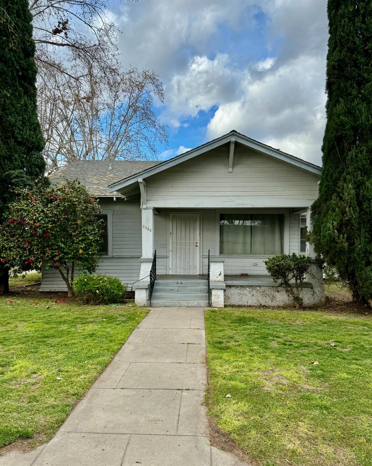 a front view of house with yard and outdoor seating