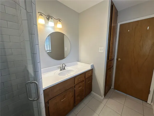 a bathroom with a sink and mirror