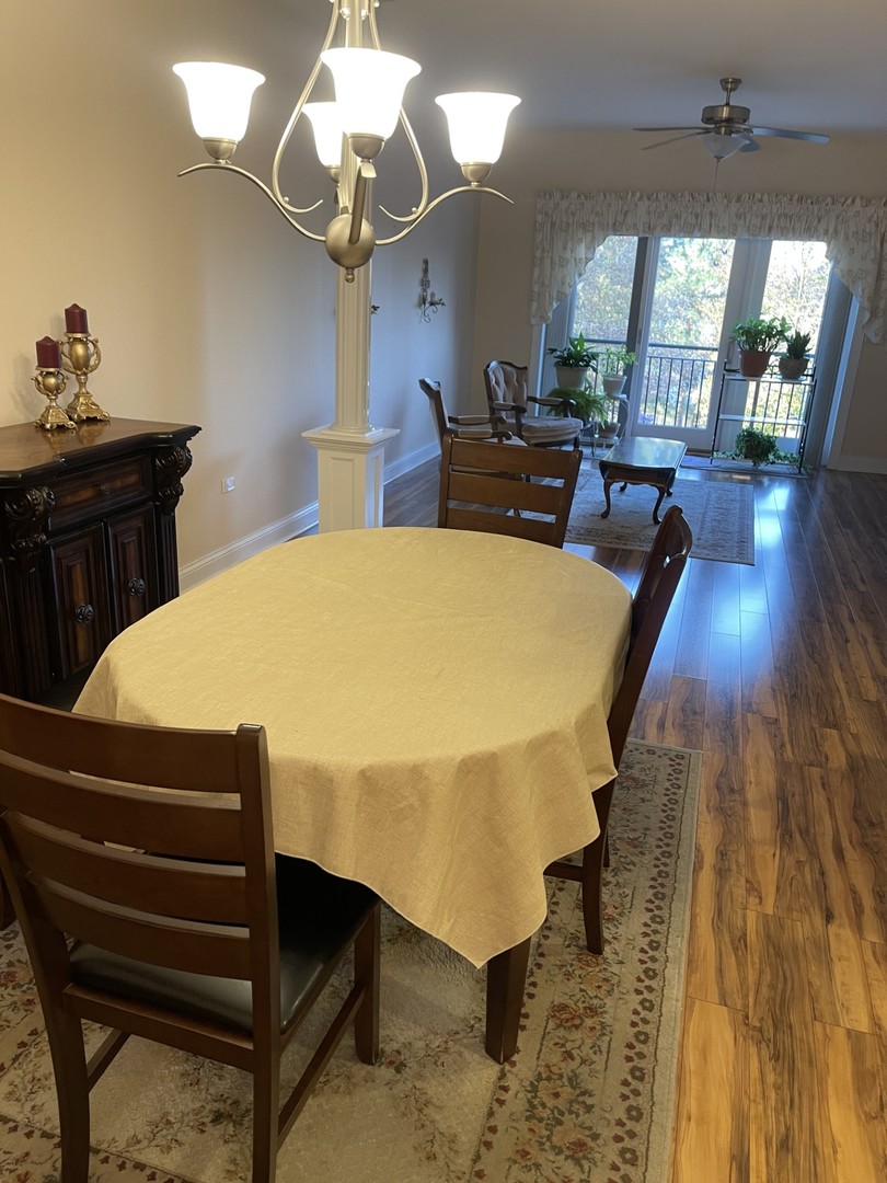 1210 Foxdale Drive, Unit 109 Addison, IL 60101 - Photo 12 of 29 a bedroom with a bed and wooden floor