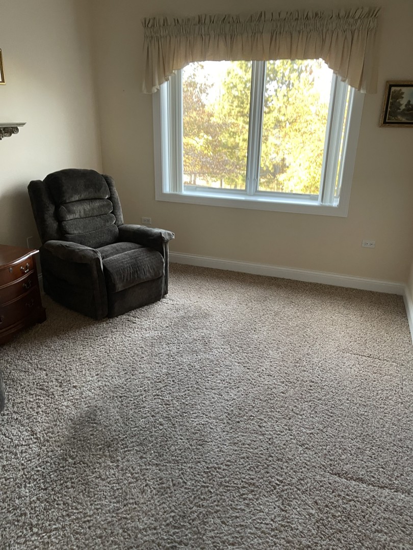 1210 Foxdale Drive, Unit 109 Addison, IL 60101 - Photo 14 of 29 a living room with furniture and a window