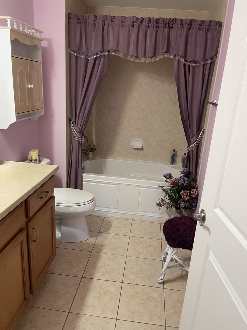 1210 Foxdale Drive, Unit 109 Addison, IL 60101 - Photo 16 of 29 a bathroom with a sink and a toilet