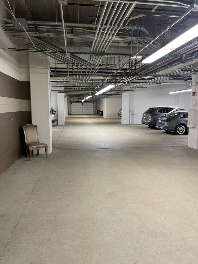 1210 Foxdale Drive, Unit 109 Addison, IL 60101 - Photo 28 of 29 a view of parking garage with cars