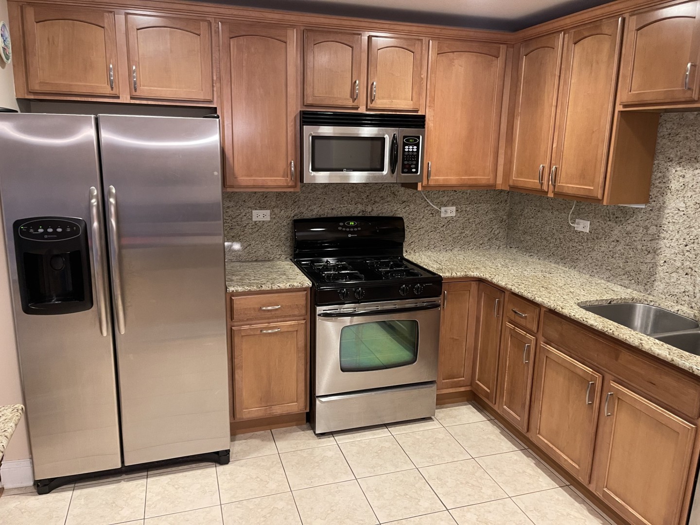 1210 Foxdale Drive, Unit 109 Addison, IL 60101 - Photo 8 of 29 a kitchen with a refrigerator stove and microwave