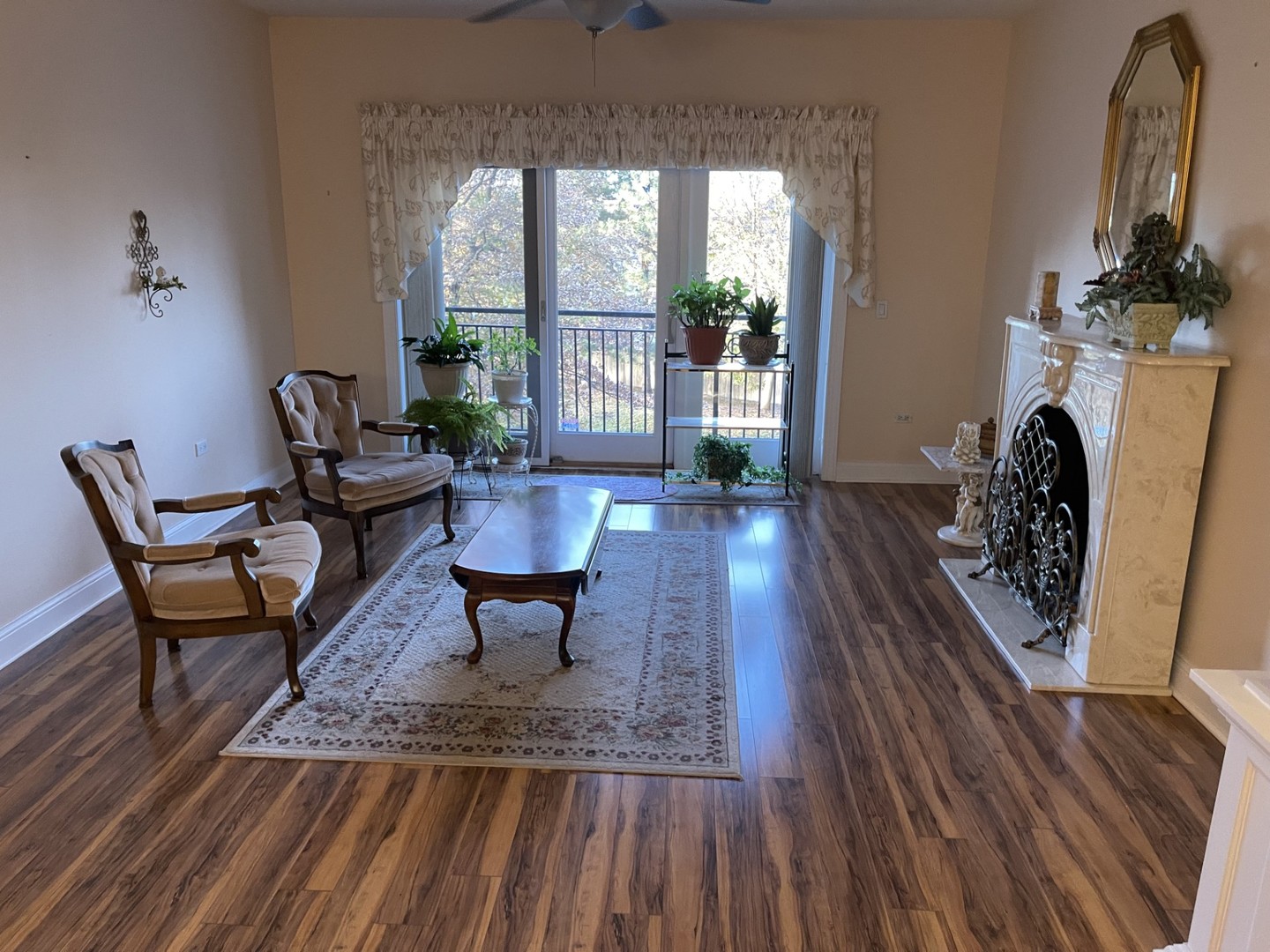 1210 Foxdale Drive, Unit 109 Addison, IL 60101 - Photo 9 of 29 a living room with furniture a fireplace and a table