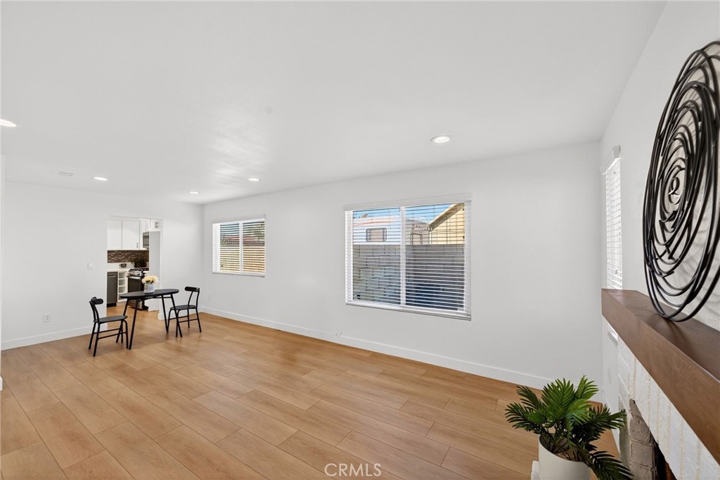831 West Cerritos Street Rialto, CA 92376 - Photo 11 of 47 a view of a livingroom with furniture wooden floor and windows