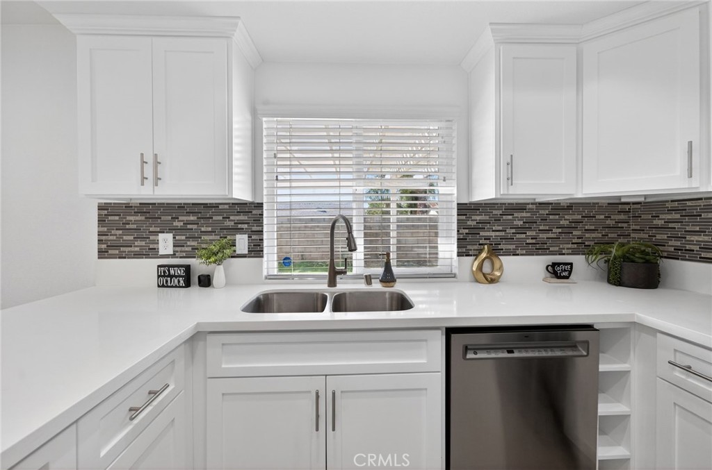 831 West Cerritos Street Rialto, CA 92376 - Photo 18 of 47 a kitchen with a sink and cabinets