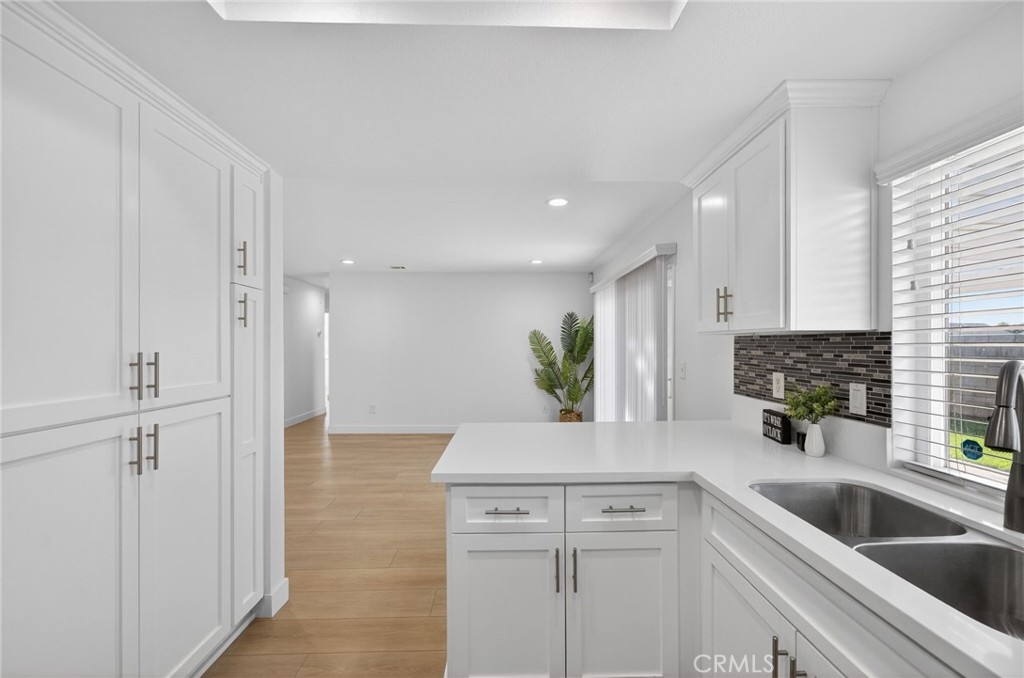 831 West Cerritos Street Rialto, CA 92376 - Photo 19 of 47 a kitchen with a sink and cabinets