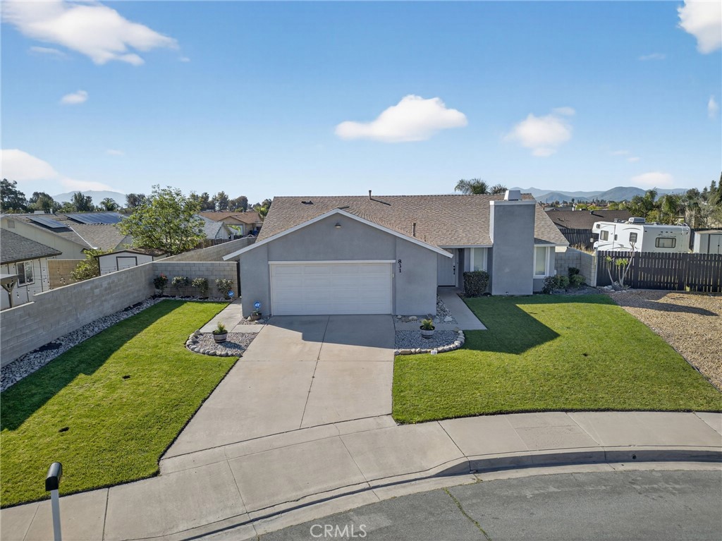 831 West Cerritos Street Rialto, CA 92376 - Photo 3 of 47 a view of a street with a houses