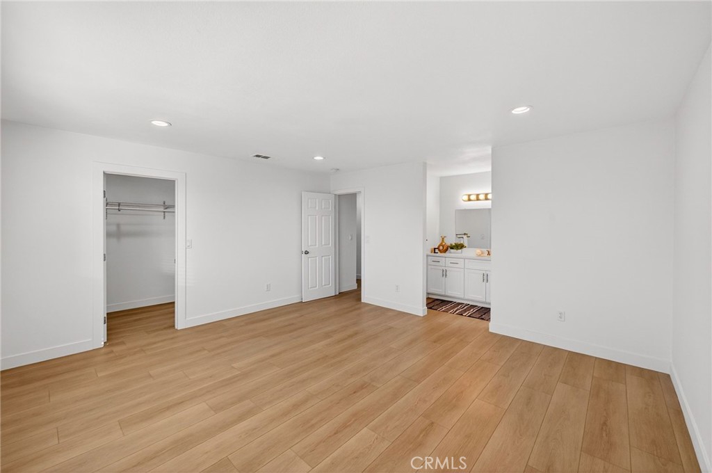 831 West Cerritos Street Rialto, CA 92376 - Photo 32 of 47 a view of an empty room with wooden floor and a window