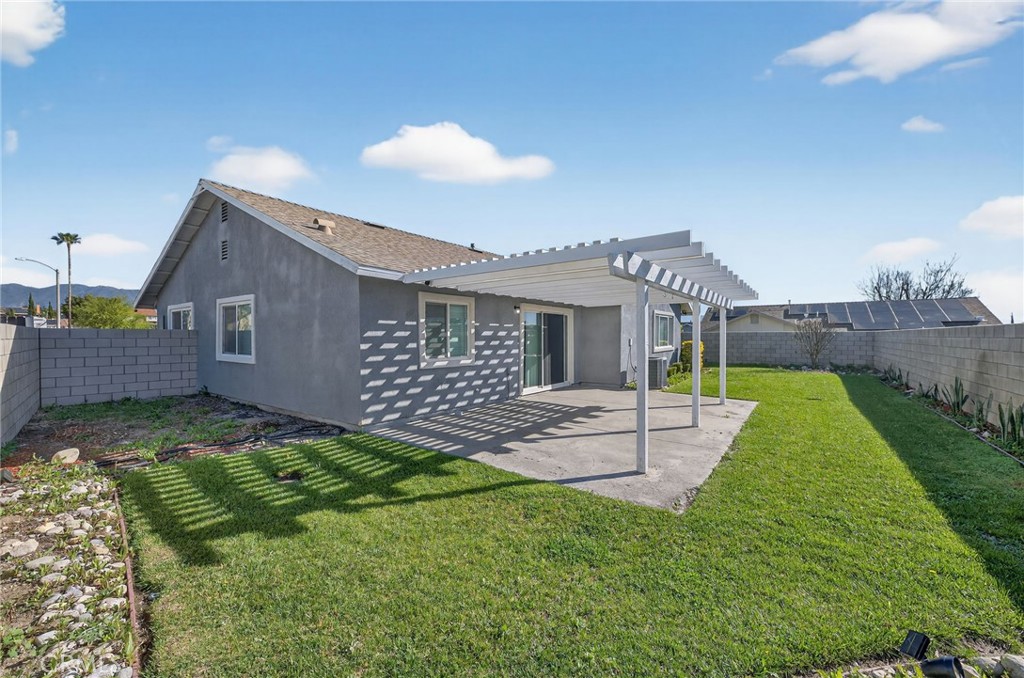 831 West Cerritos Street Rialto, CA 92376 - Photo 37 of 47 a view of a house with a yard and a garden