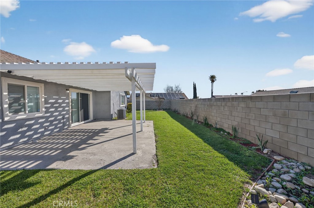 831 West Cerritos Street Rialto, CA 92376 - Photo 38 of 47 a view of a patio with a table and chairs under an umbrella