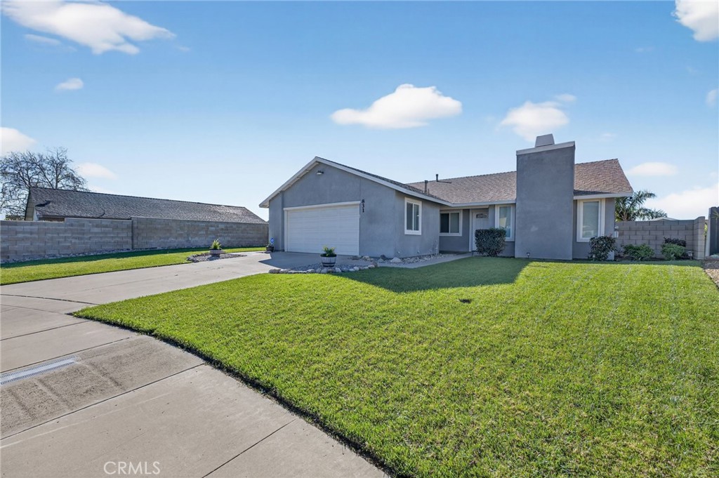 831 West Cerritos Street Rialto, CA 92376 - Photo 4 of 47 a view of an house with backyard and garden