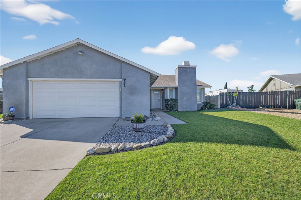 831 West Cerritos Street Rialto, CA 92376 - Photo 5 of 47 a house view with a garden space