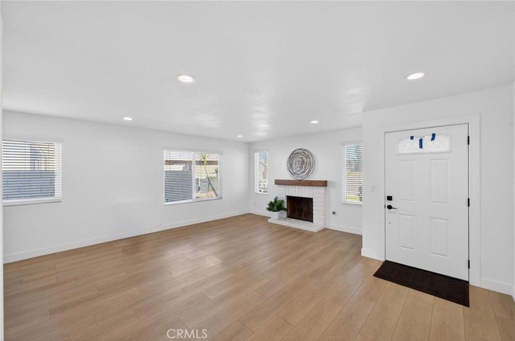 831 West Cerritos Street Rialto, CA 92376 - Photo 8 of 47 a view of empty room with fireplace