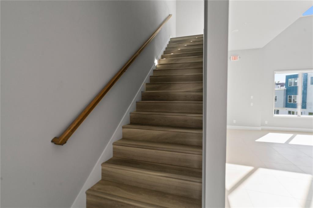 7770 Sandy Ridge Drive, Unit 239 Reunion, FL 34747 - Photo 15 of 49 a view of entryway and hall with wooden floor