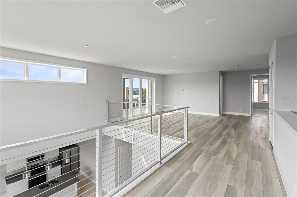 7770 Sandy Ridge Drive, Unit 239 Reunion, FL 34747 - Photo 16 of 49 a view of a room with wooden floor