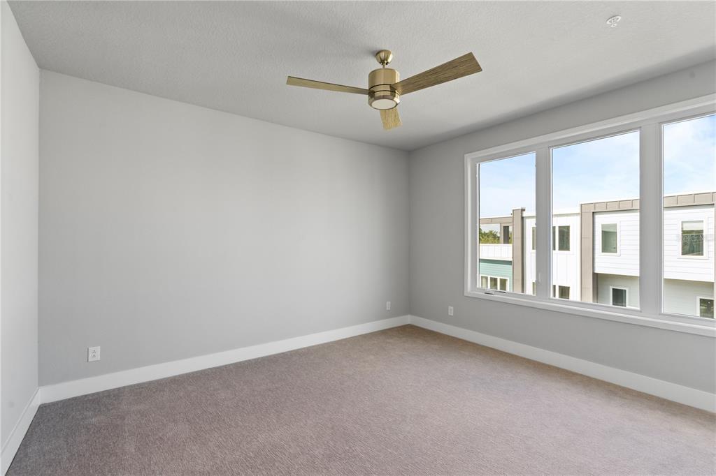 7770 Sandy Ridge Drive, Unit 239 Reunion, FL 34747 - Photo 21 of 49 an empty room with a window