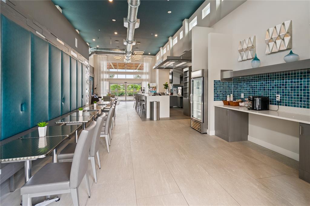 7770 Sandy Ridge Drive, Unit 239 Reunion, FL 34747 - Photo 40 of 49 a view of a kitchen with refrigerator and cabinets