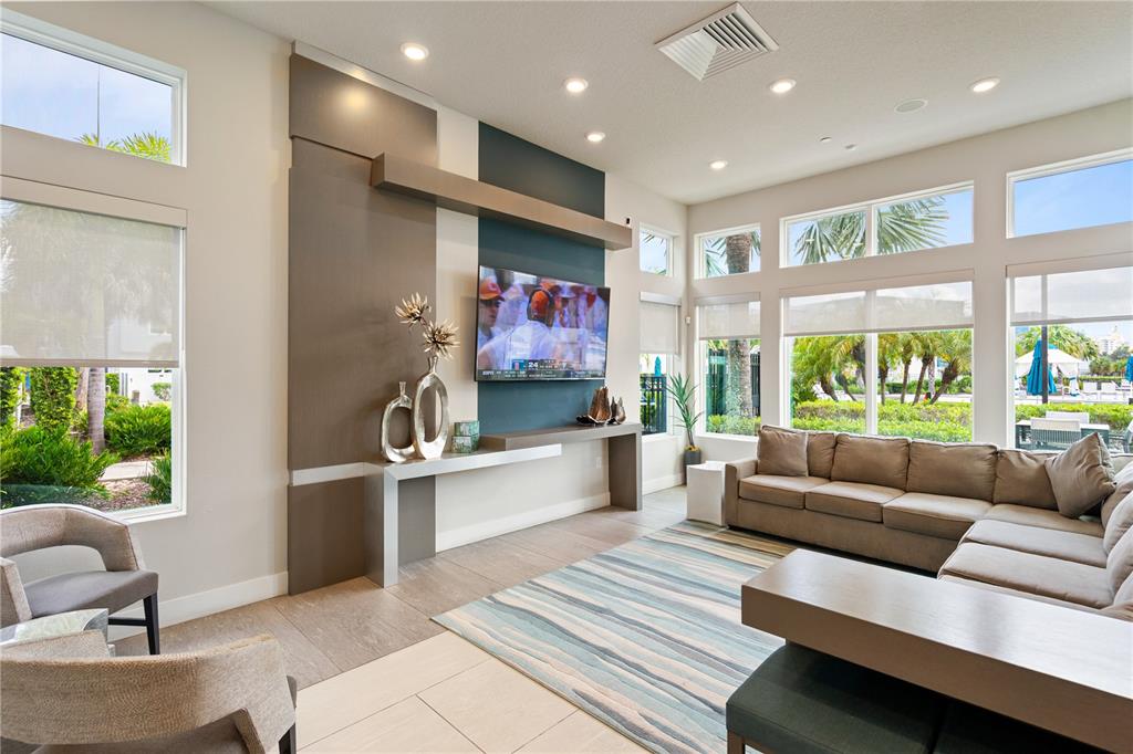 7770 Sandy Ridge Drive, Unit 239 Reunion, FL 34747 - Photo 43 of 49 a living room with furniture and a large window