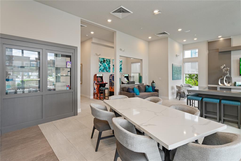 7770 Sandy Ridge Drive, Unit 239 Reunion, FL 34747 - Photo 45 of 49 a view of a dining room with furniture and window