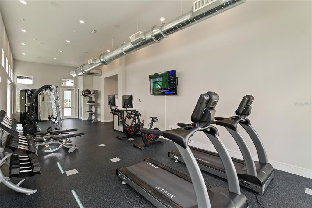 7770 Sandy Ridge Drive, Unit 239 Reunion, FL 34747 - Photo 48 of 49 a view of a room with gym equipment