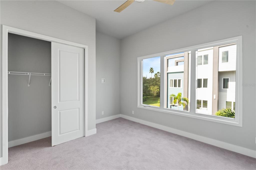 7770 Sandy Ridge Drive, Unit 239 Reunion, FL 34747 - Photo 8 of 49 a view of an empty room with a window