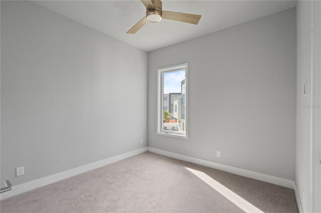 7770 Sandy Ridge Drive, Unit 239 Reunion, FL 34747 - Photo 9 of 49 an empty room with windows