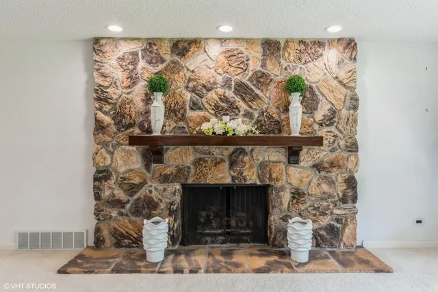 a stone house with a fireplace