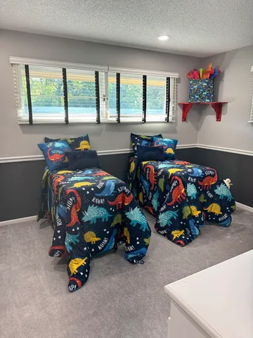 a bed room with furniture and a window