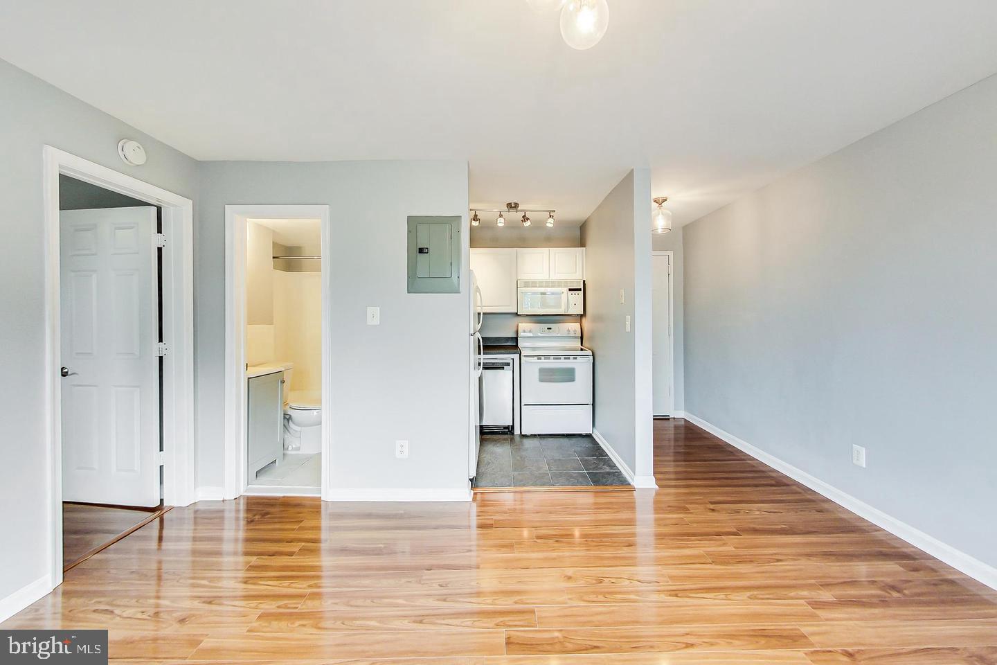 604 Longfellow Street Northwest, Unit 303 Washington, DC 20011 - Photo 6 of 12 a view of a kitchen with wooden floor and a kitchen