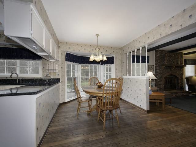 2N555 Beith Road Elburn, IL 60119 - Photo 12 of 22 a view of a dining room with furniture and wooden floor