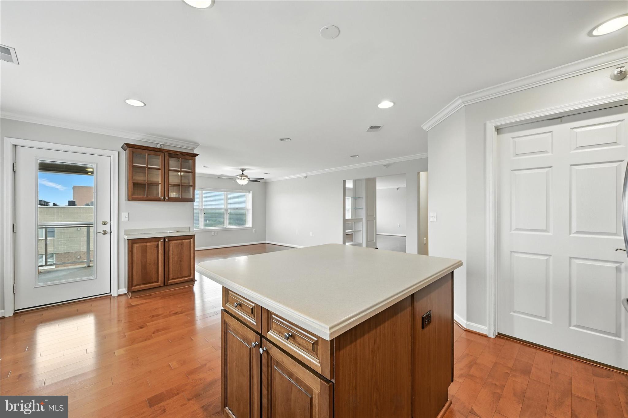 12240 Roundwood Road, Unit 808 Lutherville-Timonium, MD 21093 - Photo 14 of 31 a view of kitchen with cabinets and wooden floor