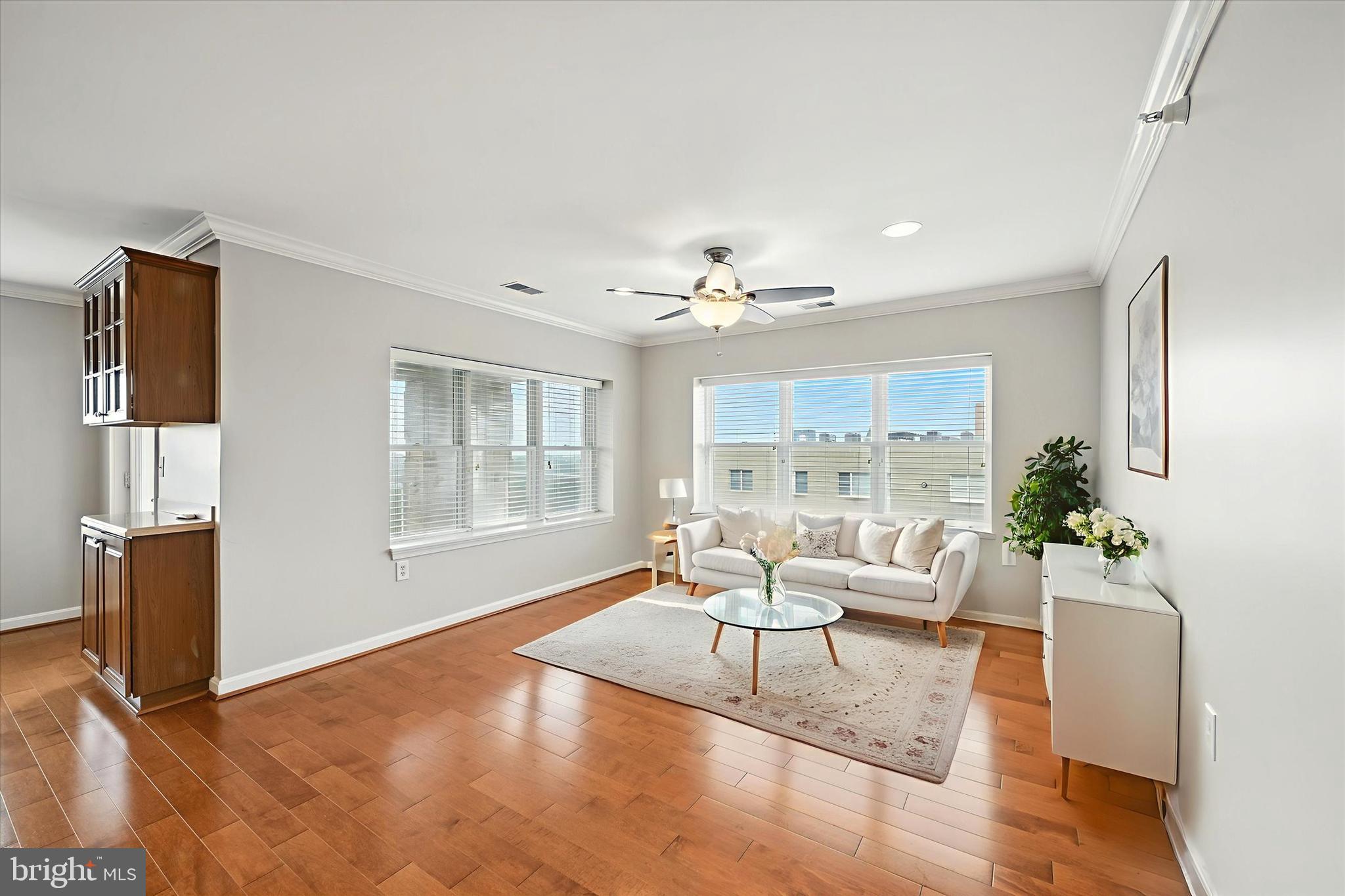 12240 Roundwood Road, Unit 808 Lutherville-Timonium, MD 21093 - Photo 16 of 31 a living room with furniture and wooden floor