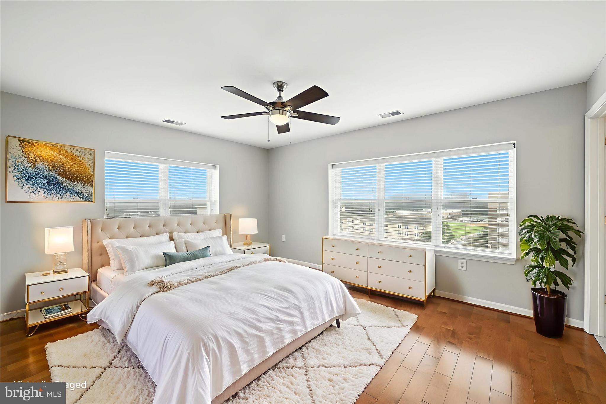 12240 Roundwood Road, Unit 808 Lutherville-Timonium, MD 21093 - Photo 21 of 31 a spacious bedroom with a large bed and a large window