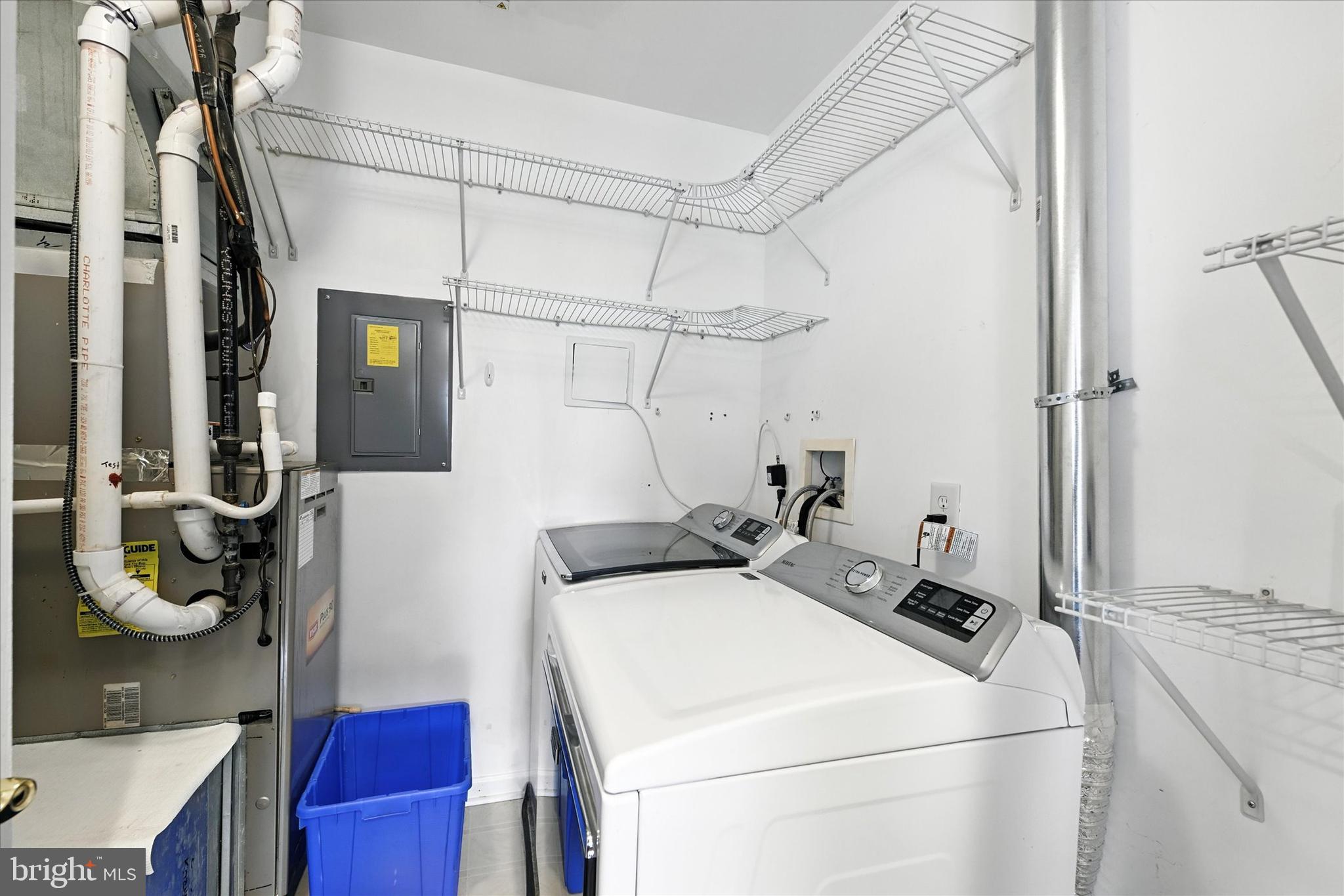 12240 Roundwood Road, Unit 808 Lutherville-Timonium, MD 21093 - Photo 28 of 31 a utility room with dryer and washer