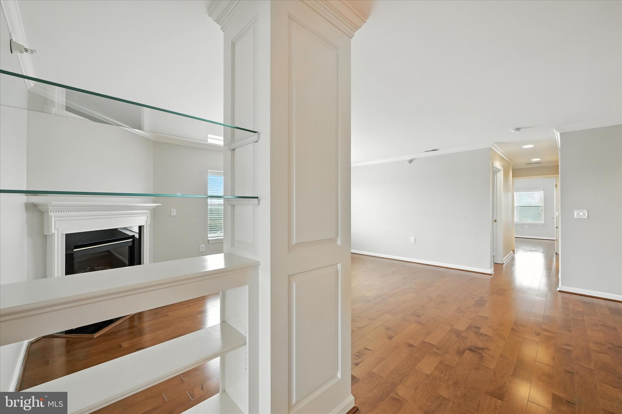 12240 Roundwood Road, Unit 808 Lutherville-Timonium, MD 21093 - Photo 7 of 31 a view of an empty room with a fireplace