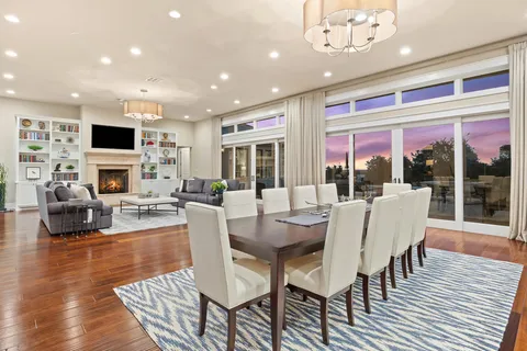 a view of a dining room with furniture window and outside view