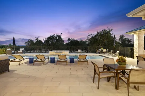 a view of a patio with couches and table and chairs with couches