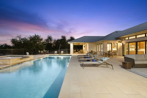 a view of swimming pool with outdoor seating